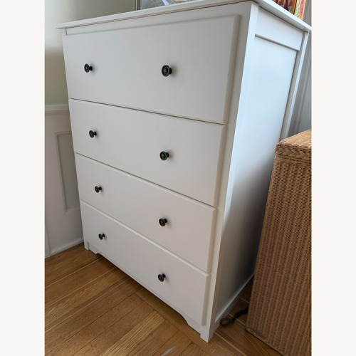Used White Four-Drawer Wooden Chest of Drawers for sale on AptDeco