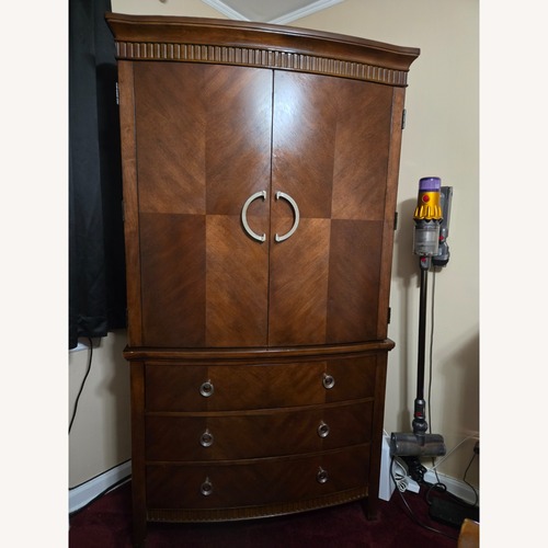 Used Ashley Furniture Dark Brown Wood Armoire for sale on AptDeco