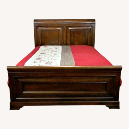 Used Ashley Furniture Dark Brown Wood Queen Bed for sale on AptDeco