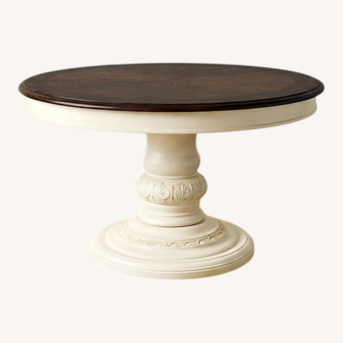 Used Vintage Dark Brown Circle Wooden Dining Table for sale on AptDeco