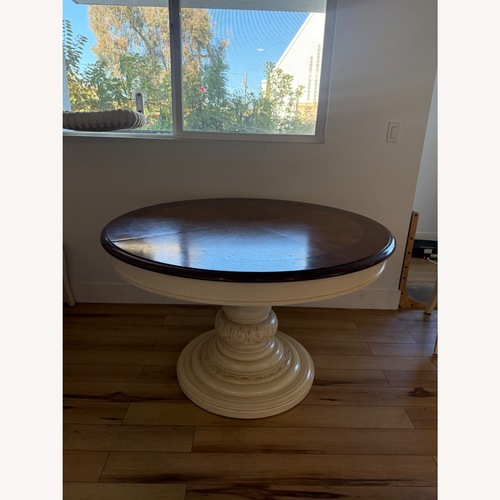 Used Vintage Dark Brown Circle Wooden Dining Table for sale on AptDeco