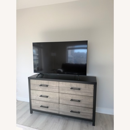 Used Bob's Discount Furniture Light Brown Wood Dresser for sale on AptDeco