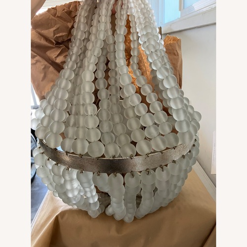 Used Currey and Company White Glass Wall Lamp for sale on AptDeco