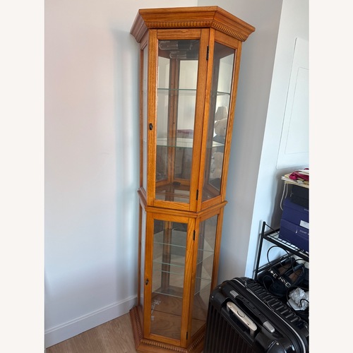 Used Wayfair Lighted English Oak Curio Cabinet for sale on AptDeco