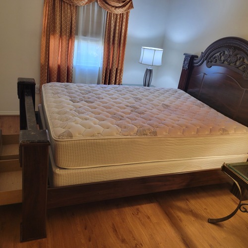 Used Dark Brown Wood King Bed for sale on AptDeco