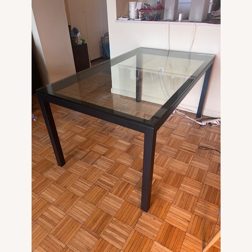 Used West Elm Black Glass Dining Table for sale on AptDeco