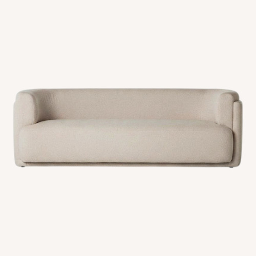 Used Four Hands Hartley Curved Cream Sofa for sale on AptDeco