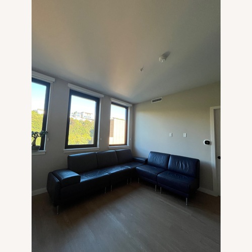 Used Vintage Natuzzi Italia Leather Sectional Navy Blue for sale on AptDeco
