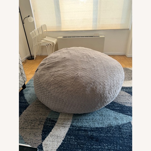 Used Raymour & Flanigan Light Gray Ottoman for sale on AptDeco