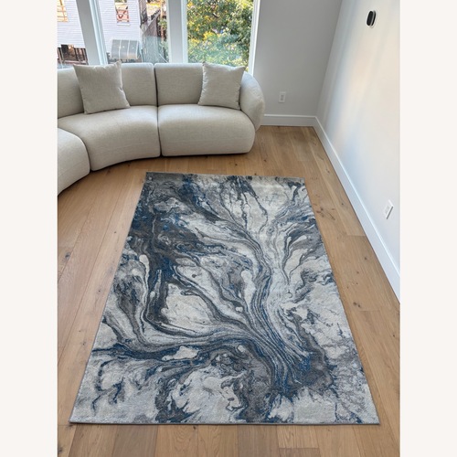 Used Cotton Area Rug 5' x 7' for sale on AptDeco
