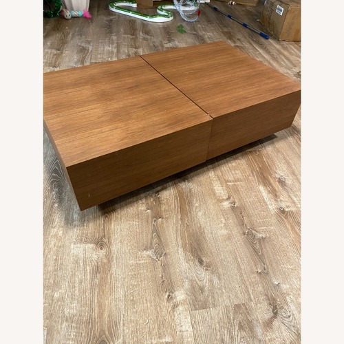Used Safavieh Couture Light Brown Wood Coffee Table for sale on AptDeco