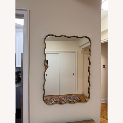 Used Wavy Gold-trimmed Mirror for sale on AptDeco