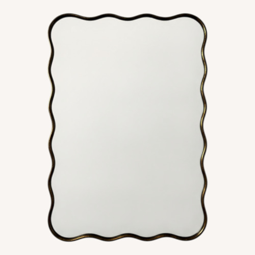 Used Wavy Gold-trimmed Mirror for sale on AptDeco