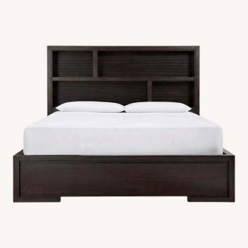 Used Raymour & Flanigan Dark Brown Wood Queen Bed for sale on AptDeco