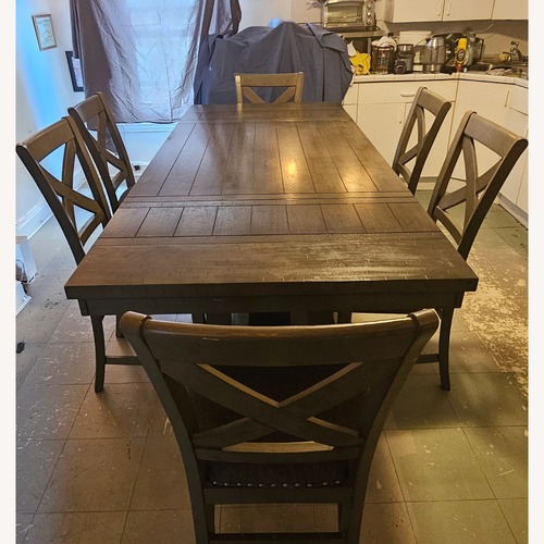 Used Ashley Furniture Caitbrook Dark Brown Wood Dining Set for sale on AptDeco