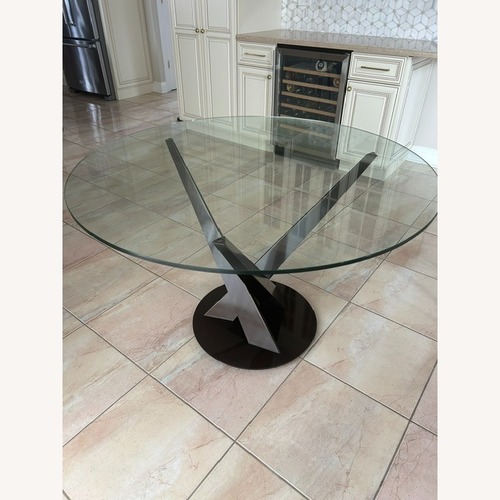 Used Elite Modern Transparent Glass Dining Table for sale on AptDeco