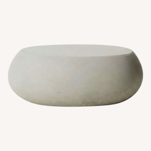 Used West Elm Pebble Indoor/Outdoor Oval Coffee Table for sale on AptDeco