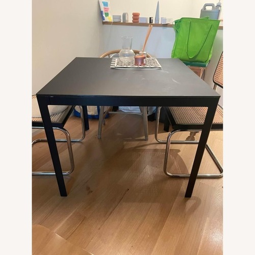 Used Design Within Reach Black Metal Dining Table for sale on AptDeco