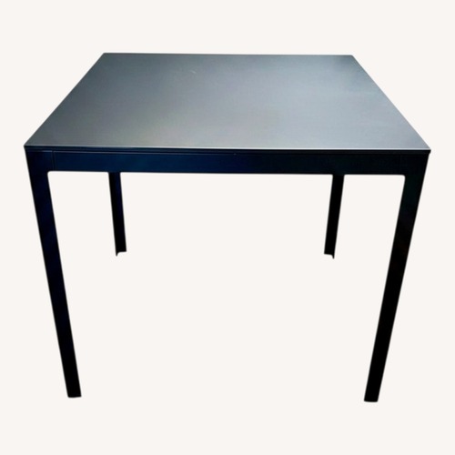 Used Design Within Reach Black Metal Dining Table for sale on AptDeco
