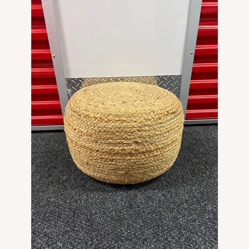 Used Pottery Barn Round Hand Braided Jute Pouf for sale on AptDeco