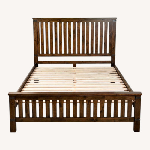 Used Ashley Furniture Dark Brown Wood Queen Bed for sale on AptDeco