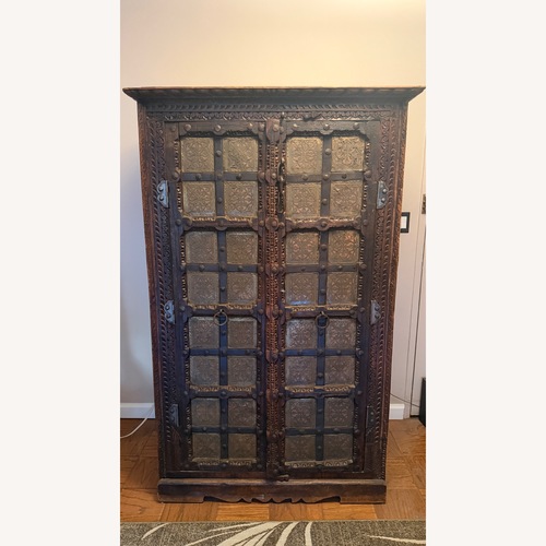 Used Vintage/Antique Finds Dark Brown Wood Armoire for sale on AptDeco