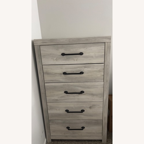 Used Ashley Furniture Cambeck Light Brown Wood Dresser for sale on AptDeco