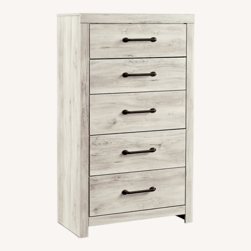 Used Ashley Furniture Cambeck Light Brown Wood Dresser for sale on AptDeco