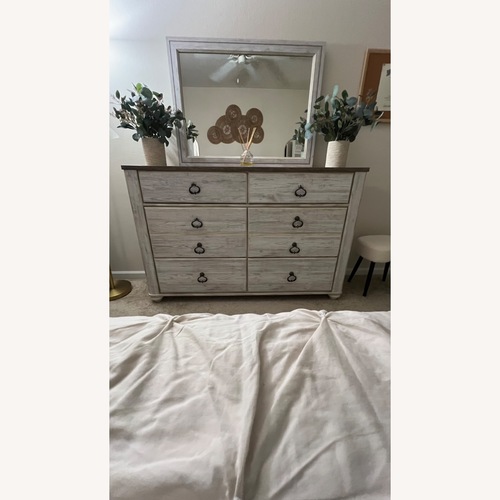 Used Ashley Furniture Wood Dresser and Mirror for sale on AptDeco