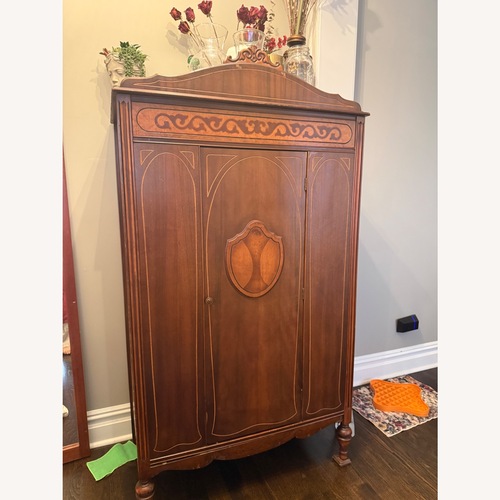 Used Vintage/Antique Dark Brown Wood Armoire for sale on AptDeco