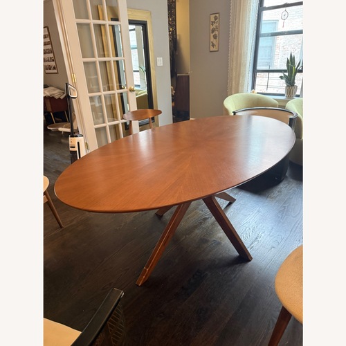 Used Poly and Bark Dark Brown Wood Dining Table for sale on AptDeco