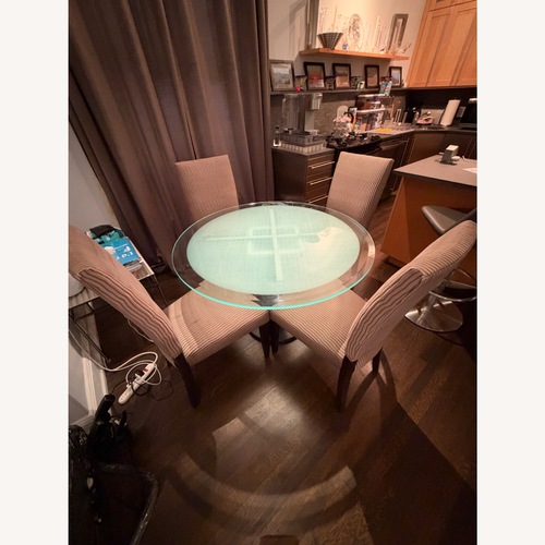Used Transparent Glass Dining Table and 4 Chairs for sale on AptDeco