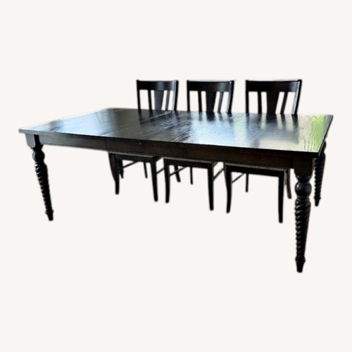 Used Bassett Dark Brown Wood Dining Table (8 seater) for sale on AptDeco