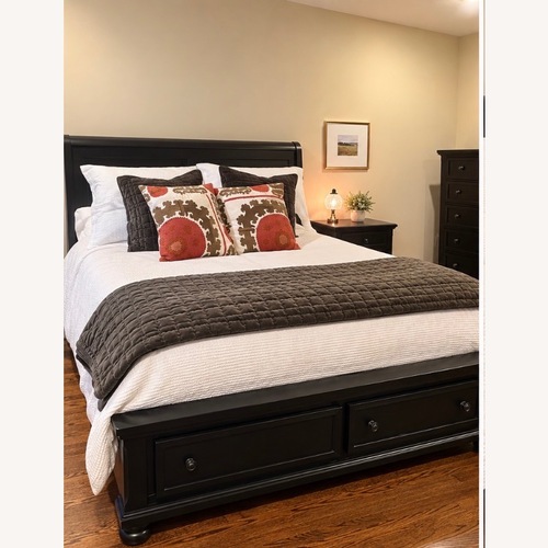 Used Black King Bed with Two Drawers in Base of Bed for sale on AptDeco