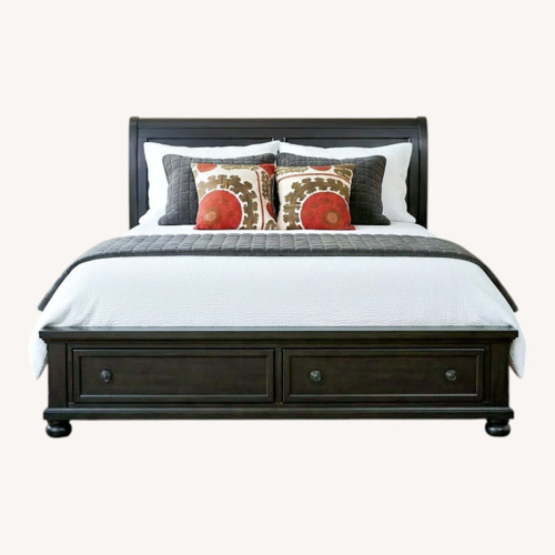Used Black King Bed with Two Drawers in Base of Bed for sale on AptDeco