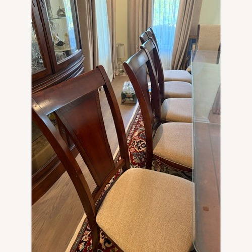 Used 12 Piece Wood Dining Chair Set  for sale on AptDeco