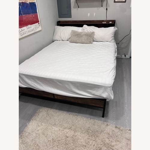 Used Dark Brown Wood Queen Bed for sale on AptDeco
