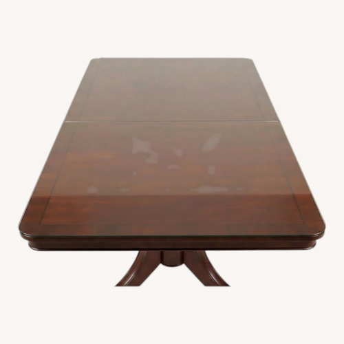 Used Dark Brown Wood Dining Table for sale on AptDeco
