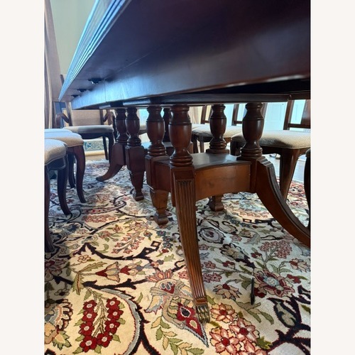 Used Dark Brown Wood Dining Table for sale on AptDeco