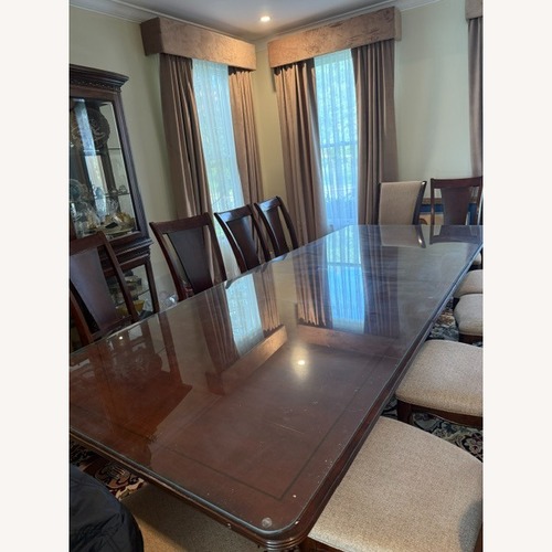 Used Dark Brown Dining Table for sale on AptDeco