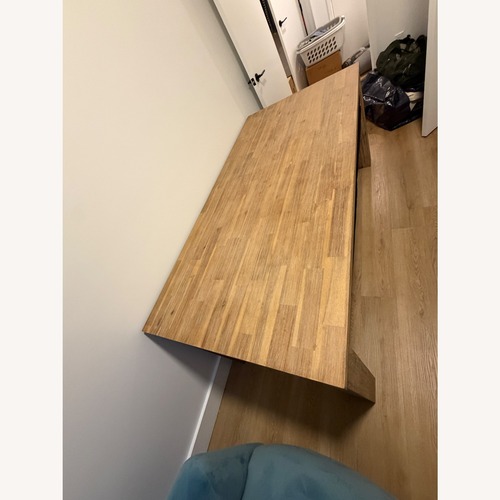 Used Light Brown Solid Accacia Wood Dining Table for sale on AptDeco