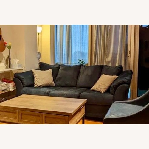 Used Ashley Furniture Darcy Sofa with Throw Pillows for sale on AptDeco