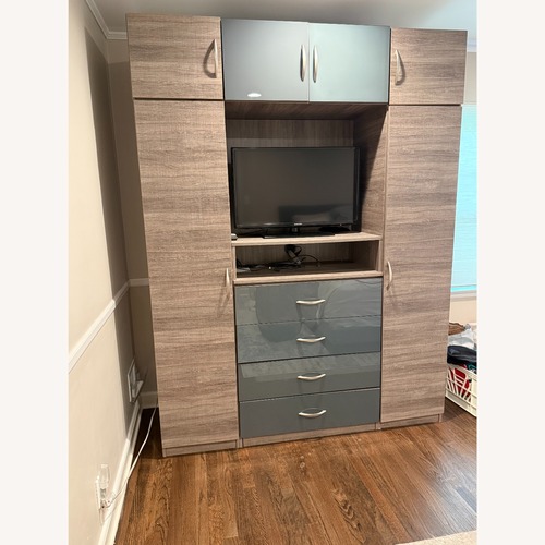 Used Contempo Space Light Gray Wood Armoire for sale on AptDeco