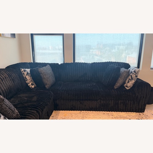 Used Ashley Furniture Black 3+ Piece Sectional for sale on AptDeco