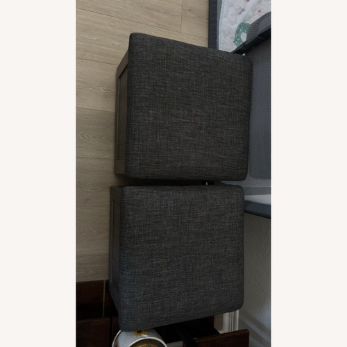 Used Coffee Table with 4 Rolling Ottomans for sale on AptDeco