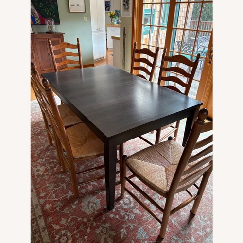 Used Crate & Barrel Wood Dining Table for sale on AptDeco