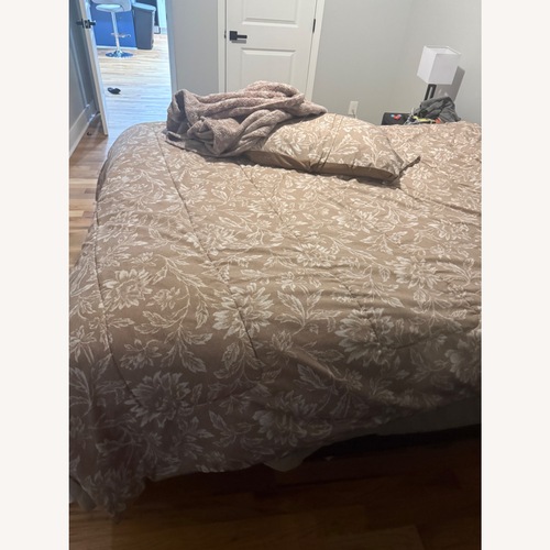Used Rooms To Go Black Wood Queen Bed for sale on AptDeco