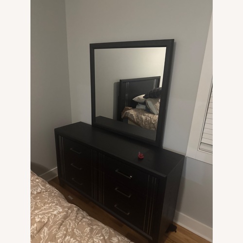Used Rooms To Go Black Wood Dresser for sale on AptDeco