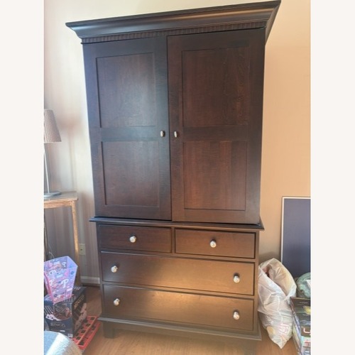 Used Cresent Furniture Dark Brown Wood Armoire for sale on AptDeco