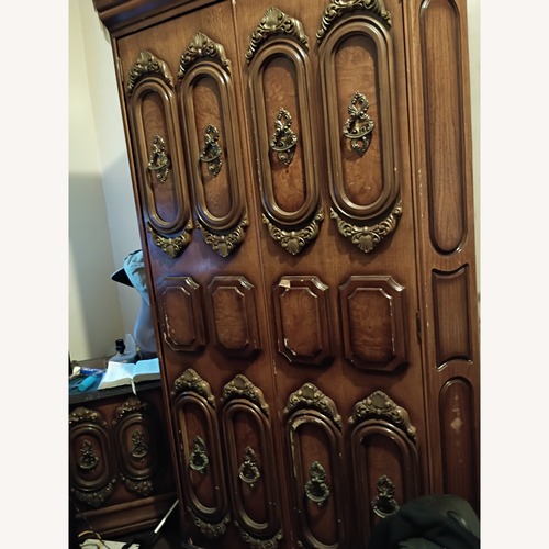 Used Dark Brown Wood Armoire for sale on AptDeco